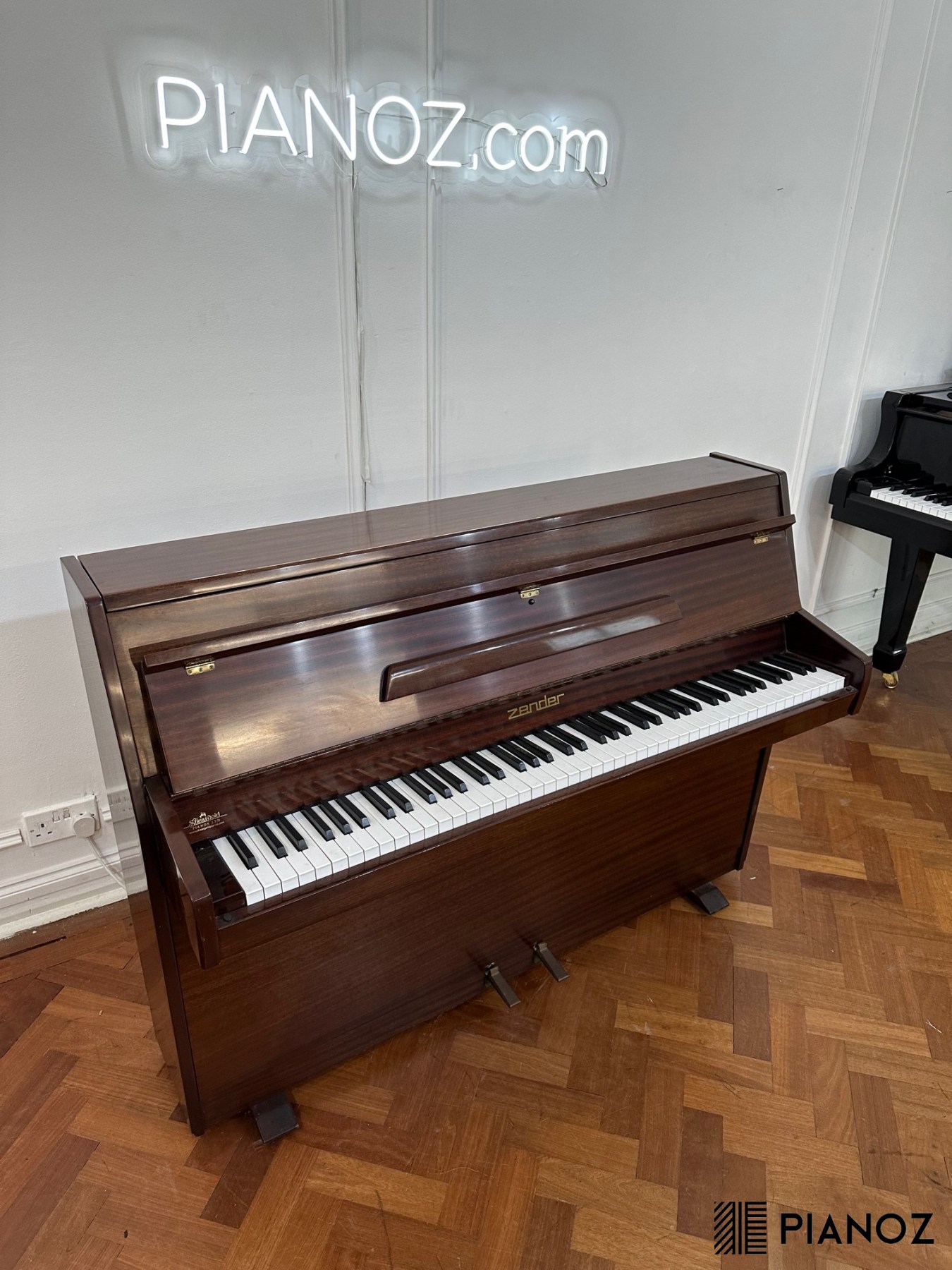 Zender deals upright piano